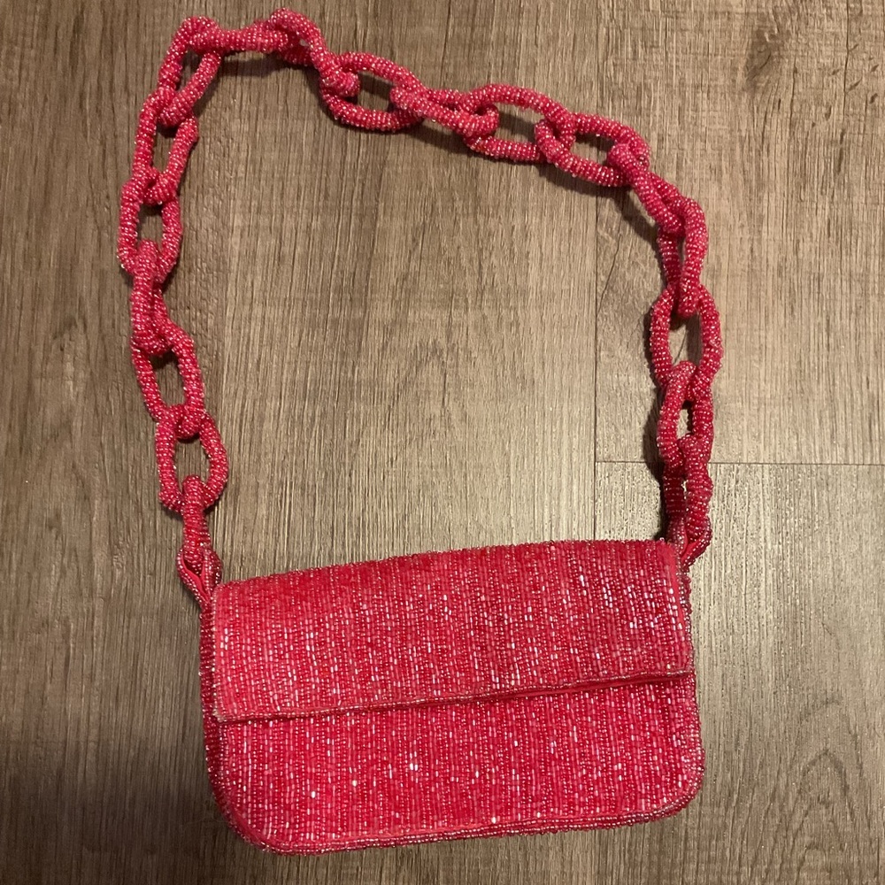 Anthropologie The Fiona Beaded designer Bag: Chain Edition in pink.